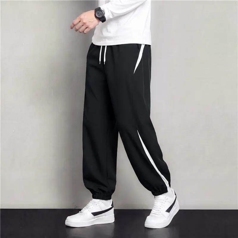 Herren Athleisure Jogginghose im Baggy‑Schnitt mit elastischem Bund, Tunnelzug und seitlichen Kontrastkeilen Drune