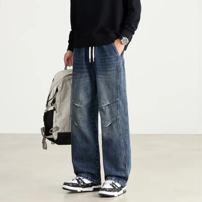 Herren Weite Denim-Hose mit Tunnelzugbund, Paneelnähten und Used-Waschung Drune